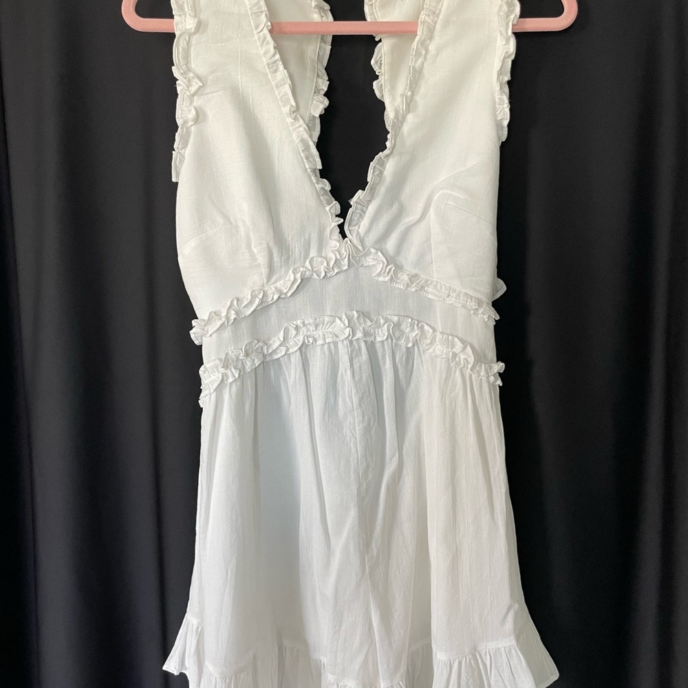 White Ruffled Sleeveless Dress.